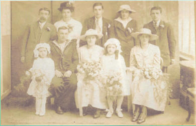 Back left:- Frederick William  & Agnes Anne Field, William Frederick Field, Elsie May Beauchamp(?), Fredrick Edward Field(?), Sitting Doris Ellen Field(?), Walter Field (Groom), Melva Beauchamp(Bride), Winifred Agnes Field(?), Rose Beauchamp(?)  (1918)